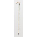 A VICTORIAN MARINE IVORY WALKING STICK WITH BALEEN SPACERS. (90cm)