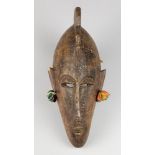 A MID 20TH CENTURY AFRICAN TRIBAL MASK. With cloth ear fabric. (h 40cm)