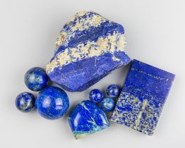A GROUP OF NINE LAPIS LAZULI OBJECTS Including a rough freeform, six spheres, a small freeform and a