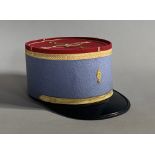 A FRENCH MILITARY ACADEMY SAINT CYR OFFICER’S KEPI (CAP). (h 10.5cm x w 17cm x d 26cm)