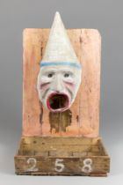 AN EARLY 20TH CENTURY PAINTED PAPIER-MÂCHÉ FRENCH FAIRGROUND PASSÉ-BOULES BALL TOSS GAME. In the