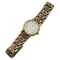 LONGINES, AN 18CT GOLD AND STAINLESS STEEL LADIES’ WRISTWATCH The circular white dial with