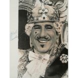 MEL BROOKS, AN AUTOGRAPHED BLACK AND WHITE PHOTOGRAPH Dressed as a theatrical King, signed in marker