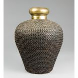 AN EARLY 20TH CENTURY INDIAN CHAINMAIL BOUND BRASS URN VASE. (h 39cm x w 27.7cm x d 27.5cm).