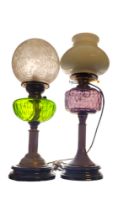 TWO VICTORIAN GILDED BRASS OIL LAMPS One with green glazed cut glass reservoirs, short column, one