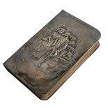AN EDWARDIAN SILVER CLAD COMMON PRAYER BOOK Having embossed figural decoration titled 'Shipley