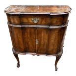 AN EARLY 18TH CENTURY STYLE SERPENTINE WALNUT SIDE CABINET With one long drawer above two doors,