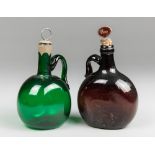TWO 19TH CENTURY GLASS FLAGON DECANTERS. Tallest 22.5cm high including stopper. Provenance: