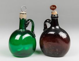 TWO 19TH CENTURY GLASS FLAGON DECANTERS. Tallest 22.5cm high including stopper. Provenance: