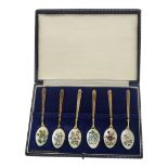 A SET OF SIX VINTAGE SILVER GILT AND ENAMEL TEASPOONS Each bowl decorated with floral designs on