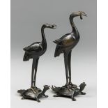 A PAIR OF LATE 19TH CENTURY JAPANESE BRONZE CRANE FIGURES UPON TURTLES. Formerly Candlesticks. (h