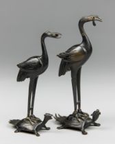 A PAIR OF LATE 19TH CENTURY JAPANESE BRONZE CRANE FIGURES UPON TURTLES. Formerly Candlesticks. (h