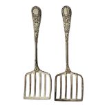 A PAIR OF VICTORIAN SILVER SWEETMEAT SERVERS Having embossed decoration and pierced bowls,