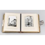 AN EARLY 20TH CENTURY LEATHER BOUND PHOTO ALBUM COMPLETE WITH 32 ORIGINAL BLACK AND WHITE