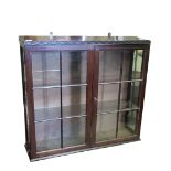 A LATE VICTORIAN MAHOGANY CASED TWO DOOR WALL CABINET Two glazed doors enclosing a later set of