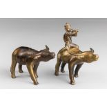 TWO EARLY 20TH CENTURY INDIAN BRONZE BUFFALO SCULPTURES. One with rider. Largest (h 14cm x w 15cm