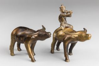 TWO EARLY 20TH CENTURY INDIAN BRONZE BUFFALO SCULPTURES. One with rider. Largest (h 14cm x w 15cm