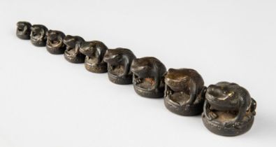 A RARE COLLECTION OF NINE 19TH CENTURY BRONZE OPIUM WEIGHTS IN VARYING SIZES, EACH MODELLED AS A