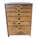A 19TH CENTURY PINE CLOCK/WATCH REPAIRERS CHEST OF SEVEN DRAWERS AND CONTENTS Comprising a brass and
