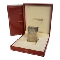 DUPONT, A VINTAGE SILVER CIGARETTE LIGHTER Having textured finish and gold plated strike wheel,