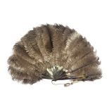 AN EARLY 20TH CENTURY TORTOISESHELL AND OSTRICH FEATHER FAN having twenty arms, each set with a