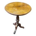 A VICTORIAN WALNUT CIRCULAR OCCASIONAL TABLE Supported on a turned melon section column with three