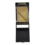 ZIPPO, A VINTAGE AMERICAN GOLD PLATED CIGARETTE LIGHTER Marked to base ‘DV11 Bradford P.A Made in