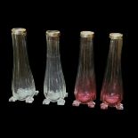 A PAIR OF EDWARDIAN CRANBERRY GLASS AND SILVER BUD VASES Graduated colour, on four square feet,