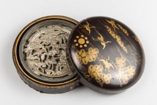 AN ANTIUQE JAPANESE BLACK AND GOLD LACQUER DOMED CIRCULAR KAGAMIBAKO (MIRROR BOX) AND COVER WITH A