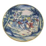 A FINE 19TH CENTURY FRENCH DELFT TIN GLAZED ISTORIATA TYPE CHARGER OF MOSES AND AARON RECEIVING
