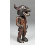 AN EARLY 20TH CENTURY SENUFO CARVED FIGURE WITH A KPONYUNGO RITUAL MASK. The Senufo people, an