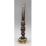 A 19TH CENTURY CARVED WOOD IFA DIVINATION TAPPER, YORUBA PEOPLE, NIGERIA. Upon a later base. (h