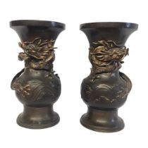 A LARGE PAIR OF 19TH CENTURY JAPANESE MEIJI BRONZE DRAGON VASES Baluster form with entwined three