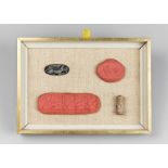 TWO EGYPTIAN SEALS WITH IMPRESSIONS MOUNTED IN A FRAMED CASE. (h 16cm x w 22.5cm x d 3.5cm)
