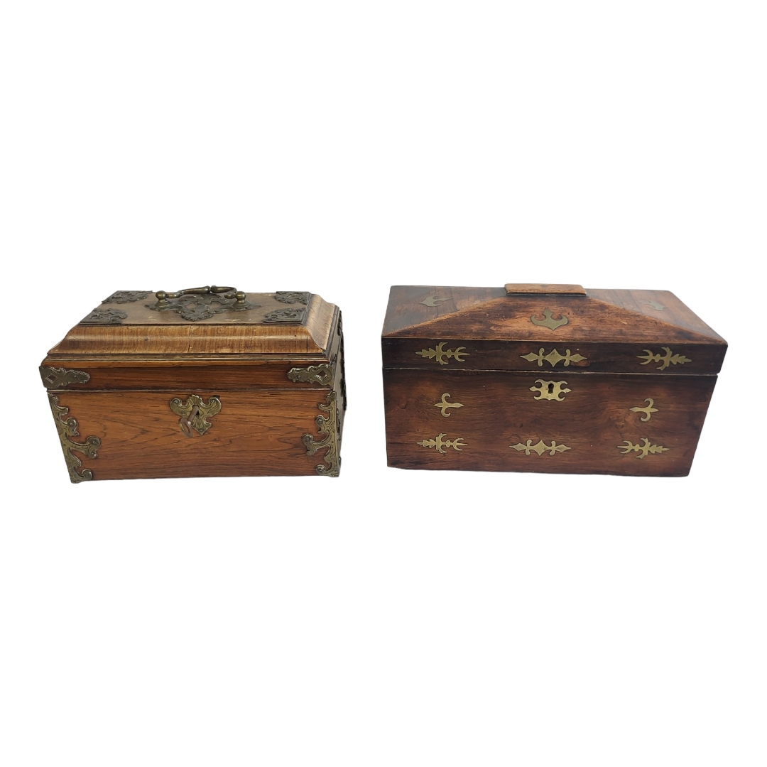 A LATE GEORGE III MAHOGANY AND BRASS INLAID FRETWORK PANELS TEA CADDY With divided two section