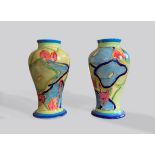 A PAIR OF EARLY 20TH CENTURY CLARICE CLIFF FANTASQUE BIZARRE 'BLUE CHINTZ' VASES. (h 15.5cm x w 8.