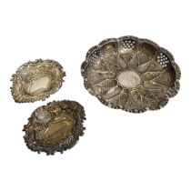 A PAIR OF VICTORIAN SILVER BON BON DISHES Having a scrolled border and pierced decoration,