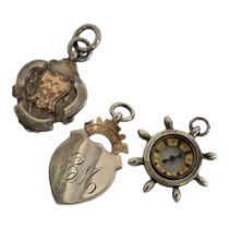A COLLECTION OF THREE VINTAGE SILVER POCKET WATCH FOBS To include compass ship's wheel hallmarked