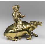 AN EARLY 20TH CENTURY CHINESE INCENSE BURNER IN THE FORM OF A MAN ON A WATER BUFFALO. The Water