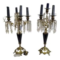 A PAIR OF EARLY 20TH CENTURY CONTINENTAL GILDED BRASS FIVE BRANCH CANDELABRA With midnight blue