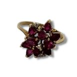 A VINTAGE CHINESE 14CT GOLD, GARNET AND DIAMOND CLUSTER RING Having an arrangement of pear cut