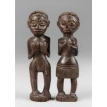 A 20TH CENTURY PAIR OF AFRICAN LUBA TRIBE CARVED MALE AND FEMALE FIGURES. Luba, Democratic