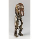 A LARGE AND UNUSUAL MID 20TH CENTURY AFRICAN CARVED MONKEY FIGURE, CONGO. With inset white shells,