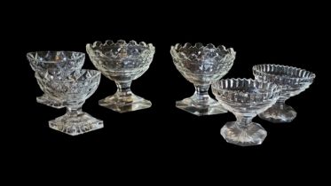THREE PAIRS OF GEORGIAN CUT LEAD CRYSTAL GLASS SALTS To include an oval pair with castle form