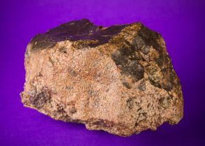 ORDINARY CHONDRITE METEORITE, MAURITANIA, NWA. A hefty rock displaying some fusion crust and shock