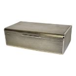 AN EARLY 20TH CENTURY SILVER CIGARETTE BOX Heavy gauge with foam formed lid and engine turned