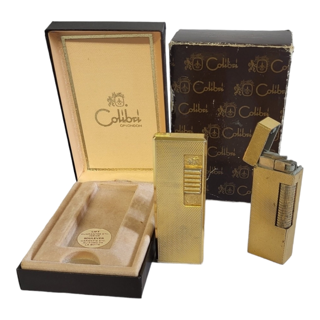 DUNHILL, A VINTAGE GOLD PLATED RECTANGULAR CIGARETTE LIGHTER With engine turned decoration, together