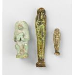 A GROUP OF ANCIENT EGYPTIAN ARTIFACTS, INCLUDING A SHABTI FIGURE AND TWO FIGURAL FAIENCE AMULETS.