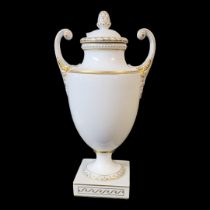 FÜRSTENBERG OF BRUNSWICK, A 20TH CENTURY HARD PASTE PORCELAIN JEWELLED NEOCLASSICAL URN AND COVER