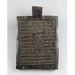 AN 18TH/19TH CENTURY PRAYER BOARD, PROFUSELY CARVED WITH ISLAMIC SCRIPT. (h 33cm x w 22cm x d